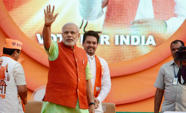 BJP Prime Ministerial candidate and Gujarat Chief Minister Naredra Modi waves at supporters during the 'Vijayi Sankhnad Yuwa Sangam' in Ahmedabad on Thursday - PTI BJP Prime Ministerial candidate and Gujarat Chief Minister Naredra Modi waves at supporters during the 'Vijayi Sankhnad Yuwa Sangam' in Ahmedabad on Thursday - PTI